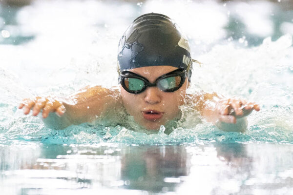 A young swimmer reaches to complete a stroke in the Dairyland Games