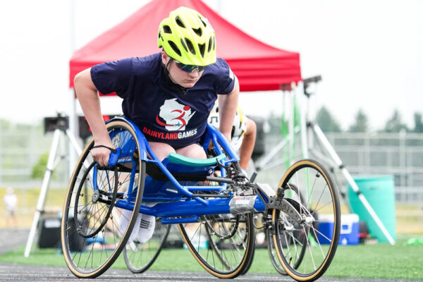 A young athlete in his wheelchair, preparing to race