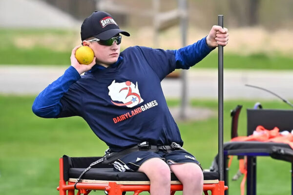 A young competitor prepares to throw a shotput at Dairyland Games